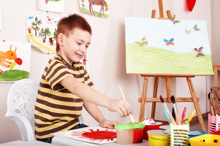 Child paint picture in preschool. Child care.の写真素材