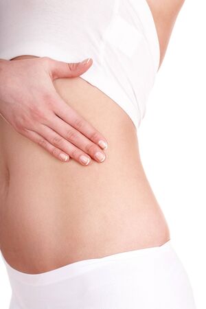 Woman with hand on abdomen. Isolated.の写真素材