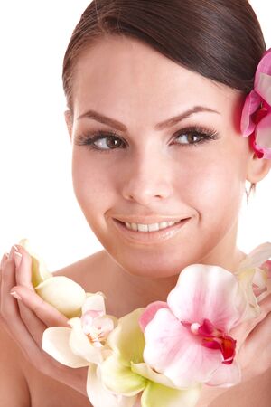 Beautiful girl with orhid flower in spa . Isolated.の写真素材