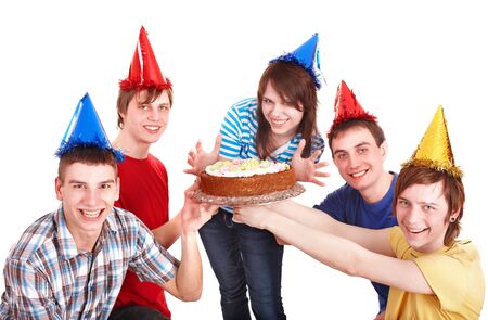Group of happy young people with cake. Isolated.の写真素材