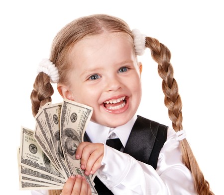 Happy little girl with money dollar. Isolated.の写真素材