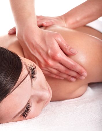 Girl having back massage. Isolated.の写真素材