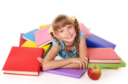 Little girl with pile of books and apple. Isolated.の写真素材