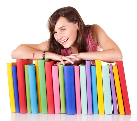 Girl with pile colored book . Isolated.の写真素材