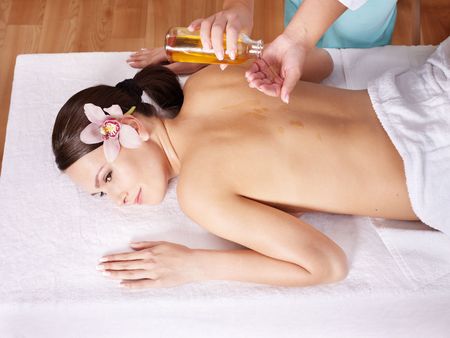 Young beautiful woman on massage table in beauty spa. Series.の写真素材