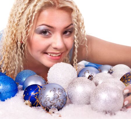 Young woman in christmas balls. Fashion studio shot"の写真素材