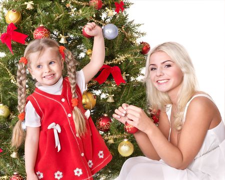 Mum with a daughter decorate christmas tree. Isolated.の写真素材