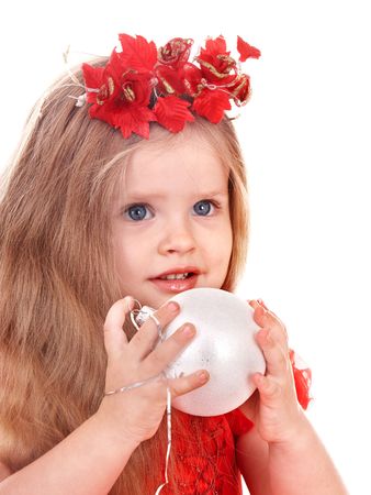 Little girl in red dress holding christmas ball. Isolated.の写真素材