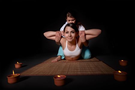Beautiful white girl having thai massage. Beauty spa.の写真素材