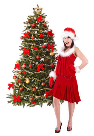 Christmas girl in santa hat holding stack  gift box.. Isolated.の写真素材