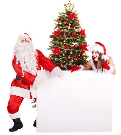 Santa claus and girl by christmas tree and gift box. Isolated.の写真素材