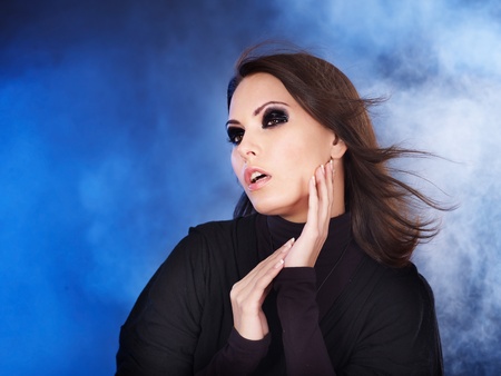 Fashion studio shot of young woman with smoky eyes .の写真素材