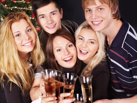 Group young people drink champagne at nightclub.の写真素材