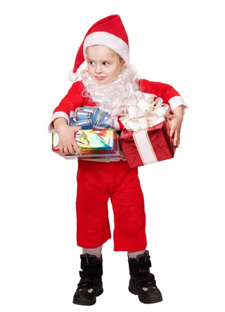 Little girl in santa hat  holding  big  red gift box. Isolated.の写真素材