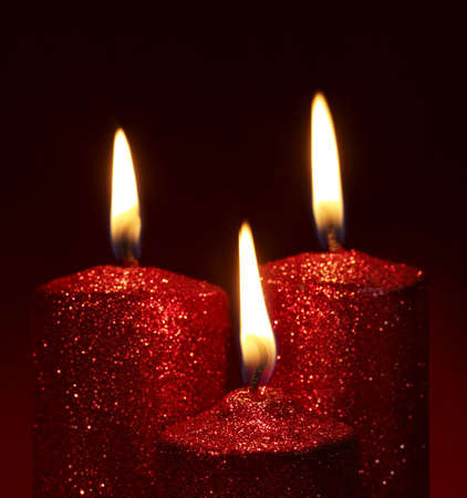 Christmas still life with group candle on red.の写真素材