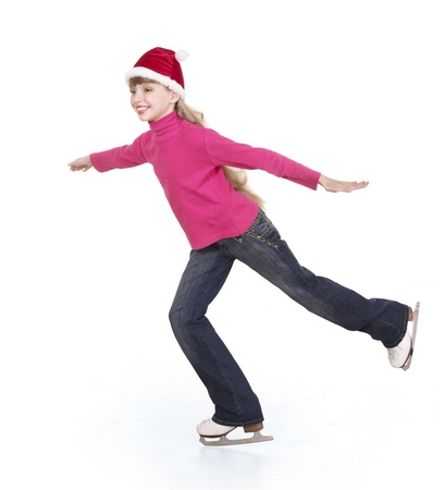 Happy young girl figure skating. Isolated.の写真素材