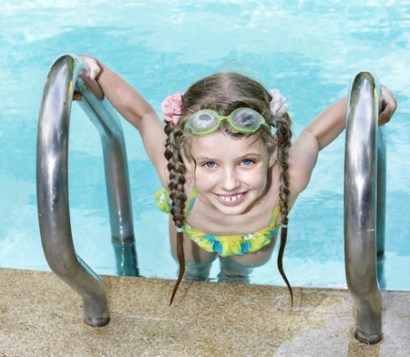 Little girl in swimming pool.の写真素材