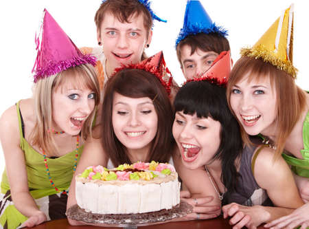 Group of happy young people with cake. Isolated.の写真素材