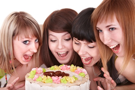 Group of happy young people with cake. Isolated.の写真素材