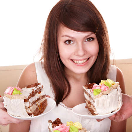 Young woman with chocolate cake. Isolated.の写真素材