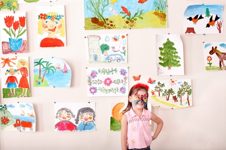 Child with  face painting in play room. Preschooler.の写真素材