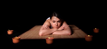 Beautiful white girl having thai massage.の写真素材
