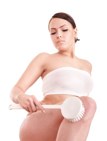 Young woman scrubbing body. Isolated.の写真素材