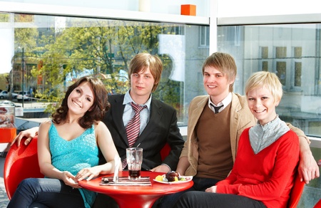Group  happy people eating  in cafe.の写真素材