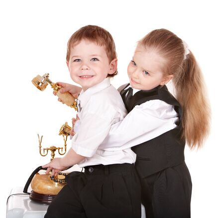 Children in business suit with telephone. Isolated.の写真素材