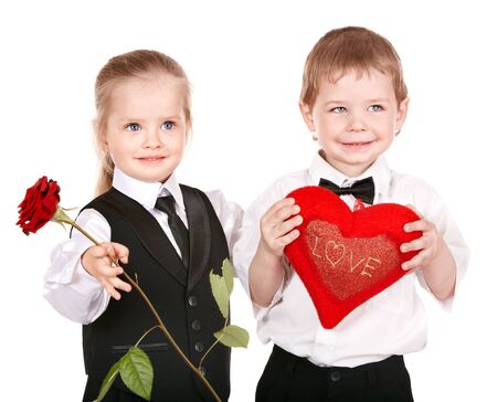 Children in business suit with rose.Valentines day.の写真素材