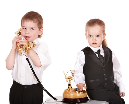 Children in business suit with telephone. Isolated.の写真素材