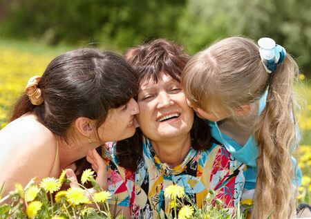 Grandmother with daughter and granddaughter  outdoors. Happy family.の写真素材