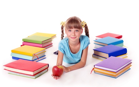 Child with pile of books  reading on floor. Isolated.の写真素材