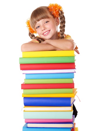 Schoolgirl  holding pile of books. Isolated.の写真素材
