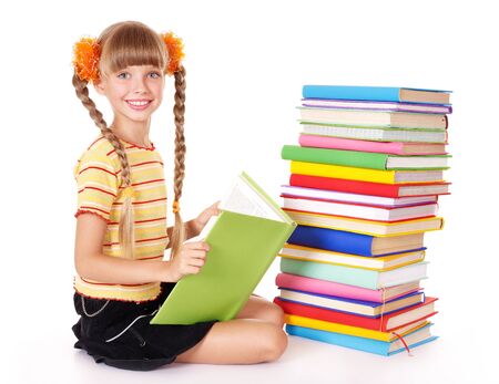 Little girl reading pile of books. Isolated.の写真素材