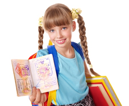 Child with pile of books and passport. Foreign education.の写真素材