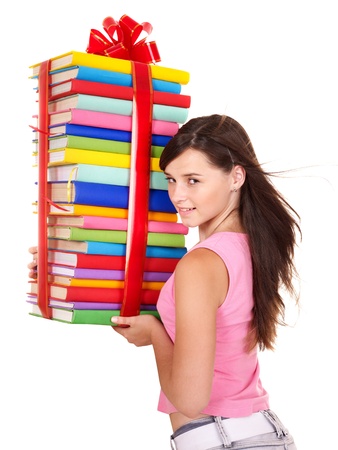 Girl holding pile of book. Isolated.の写真素材