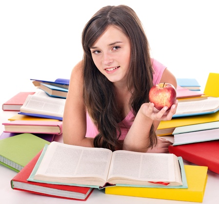 Teenager girl reading pile colored book.の写真素材