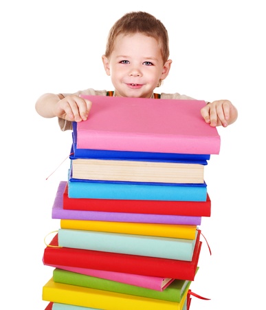 Little boy reading pile of books.の写真素材