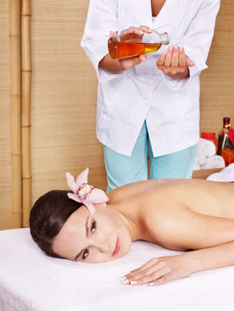 Young beautiful woman on massage table in beauty spa. Series.の写真素材