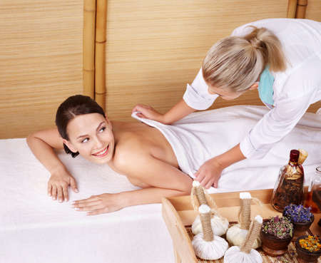 Young beautiful woman on massage table in beauty spa.  Series.の写真素材