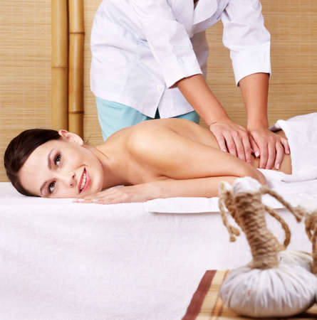 Young beautiful woman on massage table in beauty spa.  Series.の写真素材