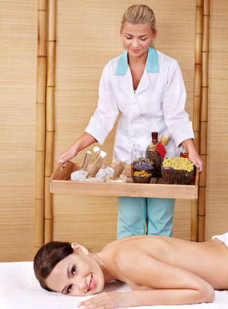 Young beautiful woman on massage table in beauty spa. Series.の写真素材