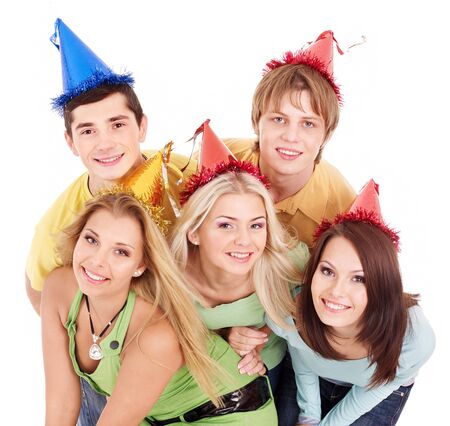 Group of young people in party hat . Isolated.の写真素材