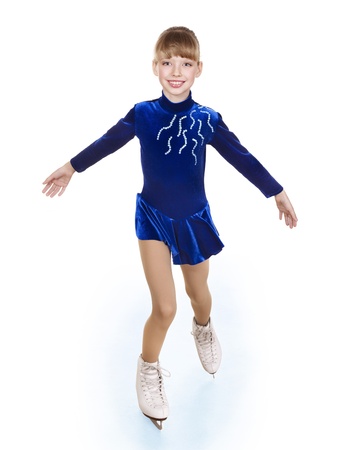 Happy young girl figure skating. Isolated.の写真素材