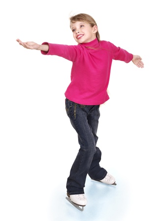 Happy young girl figure skating. Isolated.の写真素材