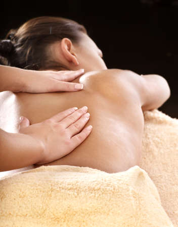 Beautiful young woman having massage.の写真素材