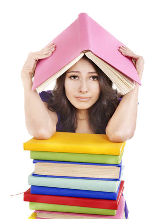 Girl with pile color book . Isolated.の写真素材