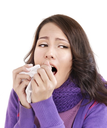 Young woman with handkerchief having  cold. Isolated.の写真素材