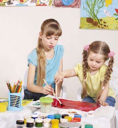Happy child painting in preschool. の写真素材